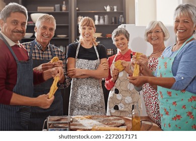 An apron is just a cape on backwards. a group of people applauding after their cooking class. - Powered by Shutterstock