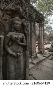 The Apsara dancer status on the wall of temple.