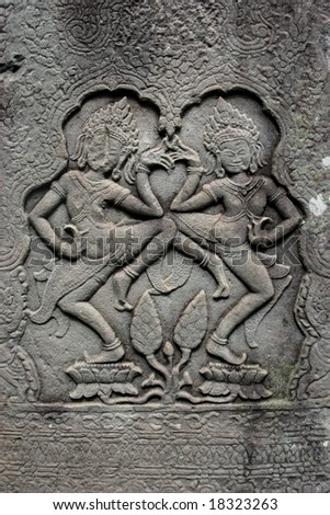 apsaraa dancer on the ancient wall in angkor complex