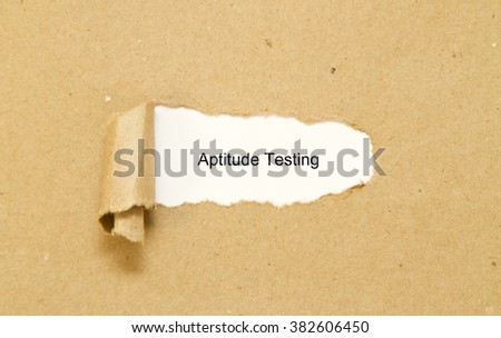 Aptitude Testing message written under torn paper.
