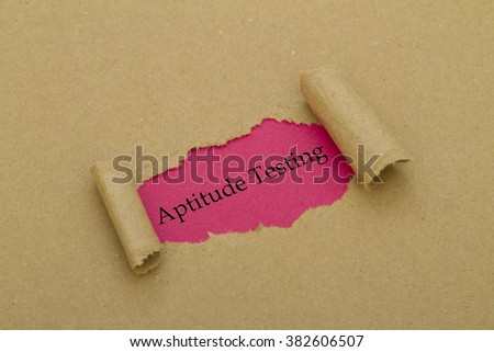 Aptitude Testing message written under torn paper.