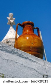 An Apulian Capasone, Clay Bowl, On A Roof Of A Trullo In Alberobello, Bari, Puglia, Italy