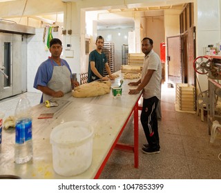 Aqaba, Jordan, March 7, 2018: Making Flatbread At The Biggest Bakery For Arabian Bread And Cake In Aqaba, Jordan, Middle East