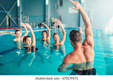 Aqua aerobics in water sport center - Shutterstock ID 670179571