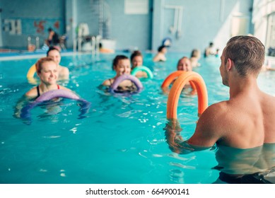 Aqua aerobics, women class with male trainer