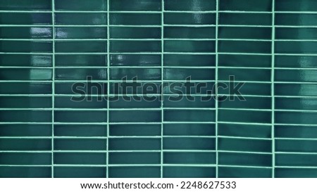 aqua dark green mosaic wall tiles in tropical style. real blue antique ceramic interior wall tiles. wall tiles background for modern, simple, bold, fresh, soft, natural concept.
