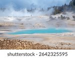 Aqua Pools and White Rocks in a Steamy Landscape in the Norris Geyser Basin In Yellowstone National Park in Wyoming