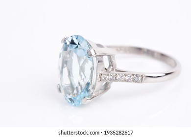 An Aquamarine And Diamond Ring On A White Background