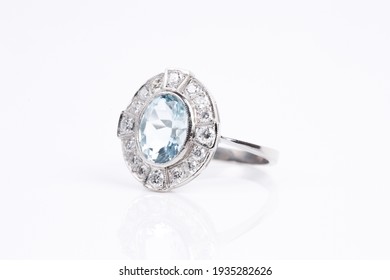 An Aquamarine And Diamond Ring On A White Background