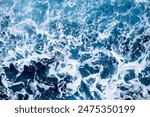 Aquamarine rough sea surface top shot, strait of messina, 2023