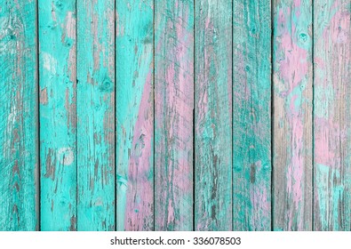 Aquamarine  wooden planks background - Colorful outer fence deteriorated by time - Closeup of wood board painted surface - Fashion texture with vintage color - Original color focus from middle 
