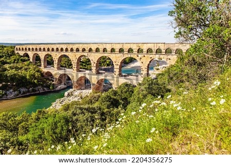 The aqueduct Pont du Gard is a three-tiered arcade. The shallow Gardon River. The Pont du Gard is the tallest Roman aqueduct. Interesting trip to France. 