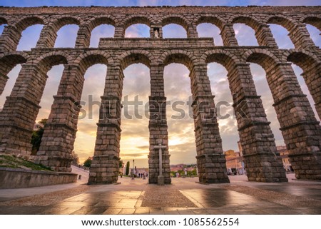 The aqueduct of Segovia, Spain, was built during the roman empire and stands as it was conceived until today. The aqueduct is built of brick-like granite blocks perfectly carved.