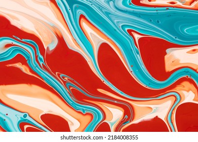 Aqueous abstract texture with swirls and watery shapes. Fluid art background with wavy paint colors mixed together. Liquid wallpaper with colorful and flowing effect of dye mix.