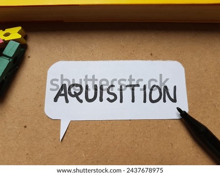 Aquisition writting on table background.