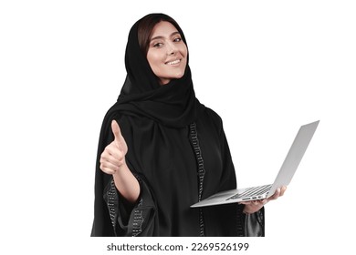 Arab abaya woman using laptop. Arabian muslim businesswoman working. - Powered by Shutterstock