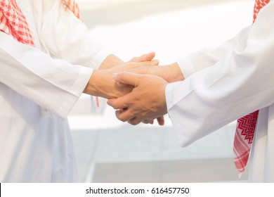 Arab Business Handshake And Business People On City Background