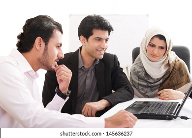 Arab Business Woman In A Meeting With Colleagues, Three Business People In The Meeting, Ethnic Business People, Business Team.