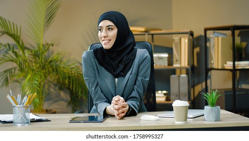 Arab Business Woman In Office. Beautiful Happy Arabic Emirati Lady In Hijab At Office Workplace. 