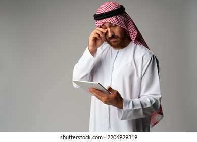 Arab Businessman Using Digital Tablet On Gray Background