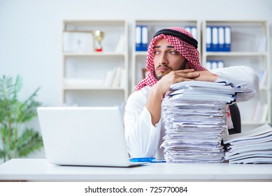 Arab businessman working in the office doing paperwork with a pi - Shutterstock ID 725770084
