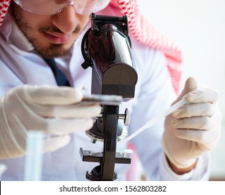 Arab Chemist Working In The Lab Office