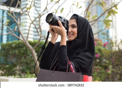 Arab Emirati Girl Taking Photos With A Photo Camera