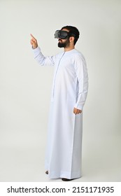 Arab Emirati Man VR Headset Enjoying Virtual Reality Wearing Traditional Isolated On Solid White Background