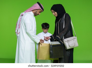Arab family looking into shopping bags