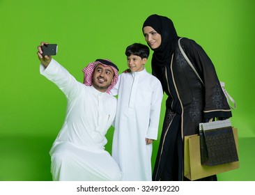 Arab Family Taking Selfie Using Mobile Camera