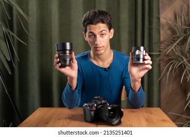 arab Guy-photographer records a video tutorial for photographers tells about different types of lenses. Online photography training, courses for photographers. copy space.