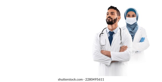 Arab Male And Female Doctor In Uniform Posing Isolated Over White Background, Professional Muslim Medical Workers Standing With Folded Arms, Ready For Treatment, Collage, Panorama With Copy Space - Powered by Shutterstock