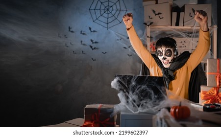 Arab Man Business Owner Wears White Clay Skull, Professional Makeup In Home Office. Emotions Of Delight. Festive Decorated Office. Halloween Sale Concept. Banner. Copy Space.