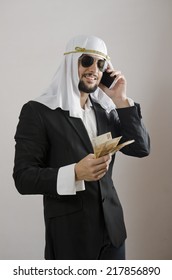 The Arab Man Businessman With Money, Suit And Phone Cliche