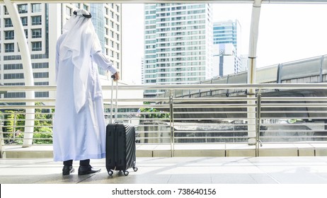 Arab Man Carry A Suitcase At Business City