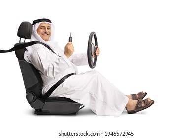 Arab Man In A Driver Seat Holding The Steering Wheel And A Car Key Isolated On White Background