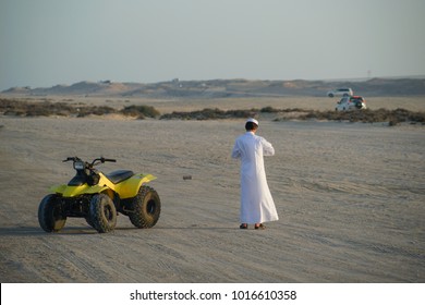 Arab Man With Dune Buggy Having Fun In Traditional Dish Dash