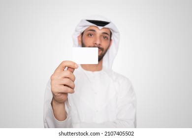 Arab Man Holding White Blank Card
