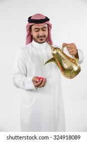 Arab Man Pouring Coffee Into Cup