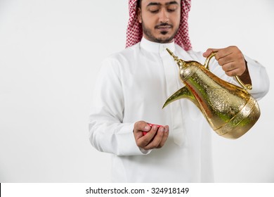 Arab Man Pouring Coffee Into Cup