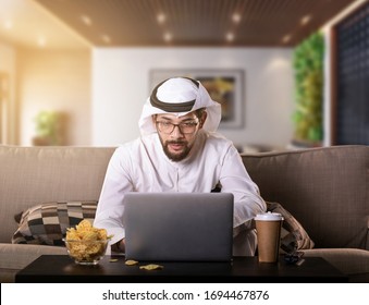 Arab Man Working From Home Sitting On Sofa Night Time. Coronavirus Quarantine.