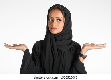 Arab Middle Eastern Saudi Woman In Traditional Formal Abaya, On White Isolated Background, With Different Poses, Expressions, Hand And Gestures, Studio Lighting Ready For Cutout And Editing.