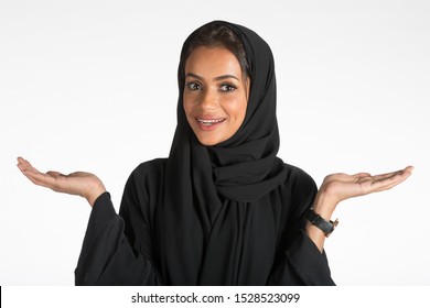 Arab middle eastern Saudi woman in traditional formal Abaya, on white isolated background, with different poses, expressions, hand and gestures, studio lighting ready for cutout and editing.