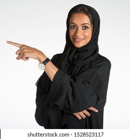 Arab Middle Eastern Saudi Woman In Traditional Formal Abaya, On White Isolated Background, With Different Poses, Expressions, Hand And Gestures, Studio Lighting Ready For Cutout And Editing.