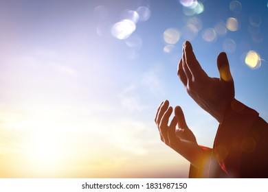 Arab Muslim Man Hands Pray Under Sunrise Light