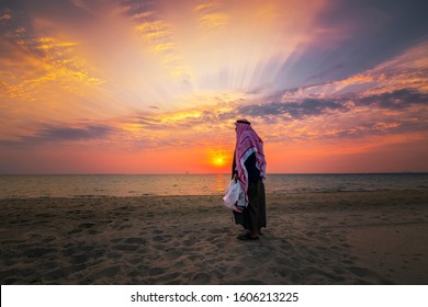 An Arab Old Man Standing In Fanateer Beach With Sunrise Background. Al Jubail City -Saudi Arabia. Clicked On 03-Jan-2020.