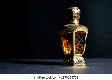 Arab perfume in exclusive bottle. Yellow colour liquid perfume specially made in classic and exotic bottle.