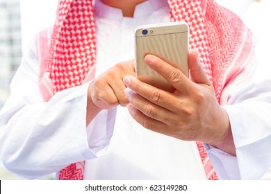 Arab Saudi Emirates Man Hand Texting In A Smart Phone 