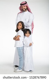 Arab Saudi father with his daughter and son, in various poses and expressions, on white isolated background, ready for cutout and design purposes.