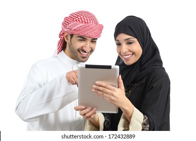 Arab Saudi Happy Couple Browsing A Tablet Reader Isolated On A White Background            